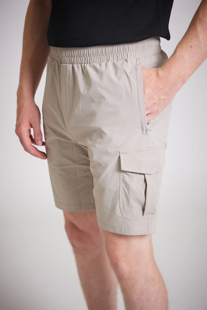 Utility shorts men stone cargo pockets close up
