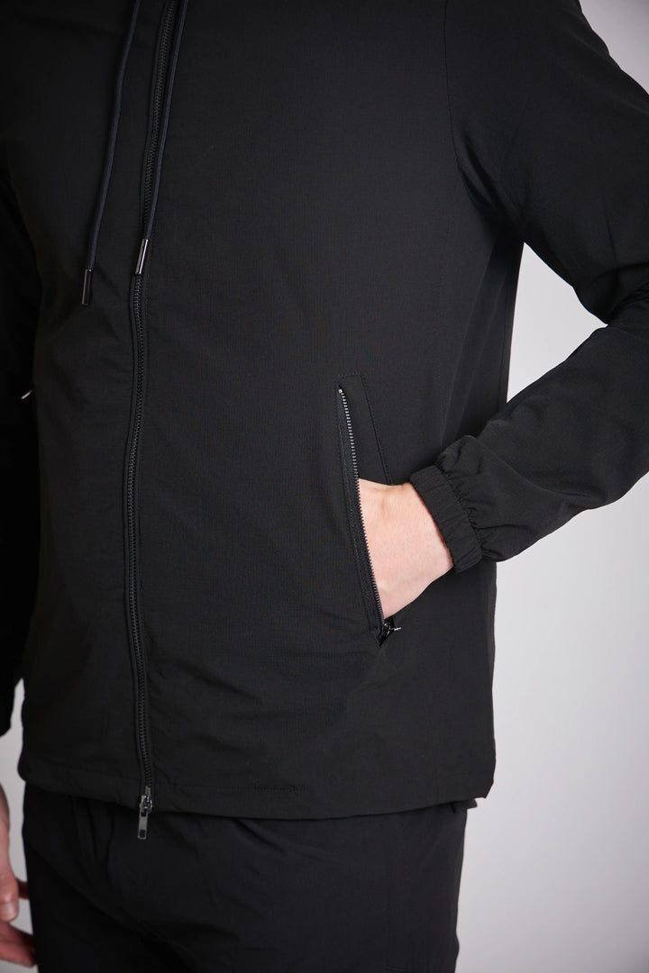 Cargo jacket men's black drawstring hood close up
